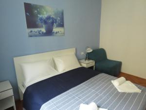 A bed or beds in a room at Casa Belfiore B&B
