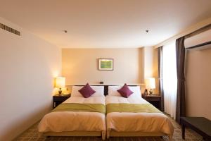 Katil atau katil-katil dalam bilik di Sky Hotel Uozu