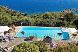 a swimming pool with a view of the ocean at Residence Roc E Mare Cargèse in Cargèse +126 photos