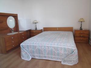 Кровать или кровати в номере Residencial Galo D'Ouro