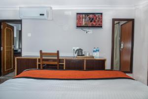 Letto o letti in una camera di Hotel Raniban Arcade