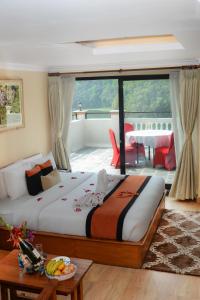 Letto o letti in una camera di Hotel Raniban Arcade