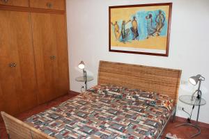 En eller flere senge i et værelse på Residence Villa La Pineta