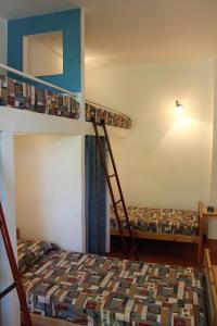 two bunk beds in a room with a bed at Residence Villa La Pineta in Cavo +36 photos