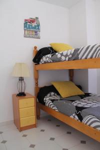 A bed or beds in a room at Apartamento Promar