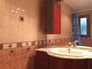 a bathroom with a sink and a shower at Villa Merce in Botarell +26 photos