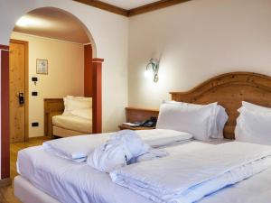 Voodi või voodid majutusasutuse Hotel Bertelli toas