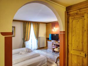 Voodi või voodid majutusasutuse Hotel Bertelli toas