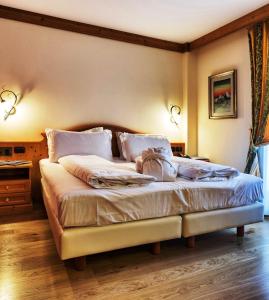 Voodi või voodid majutusasutuse Hotel Bertelli toas