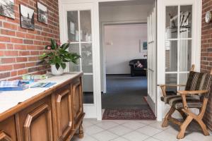 a kitchen with a door leading into a living room at Pension KRUSE in Büsum