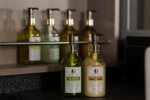 a row of wine bottles sitting on a shelf at Hotel Plant Garden Resort (Adult Only) in Toyokawa