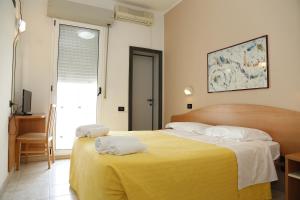 Кровать или кровати в номере Hotel Villa Dina