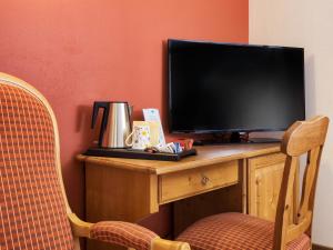 Televiisor ja/või meelelahutuskeskus majutusasutuses Hotel Bertelli