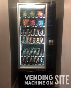 a black and white photo of a vending machine at easyHotel South Kensington in London