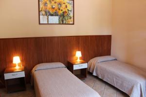 A bed or beds in a room at Villa Giglio