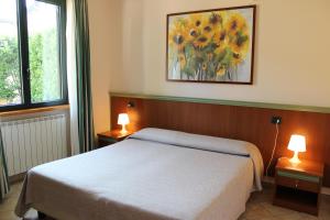 A bed or beds in a room at Villa Giglio