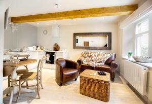 a living room with a couch and a table at The Stables in Settle