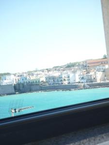 a view of a body of water from a window at Otranto Mon Amour in Otranto