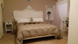 Posteľ alebo postele v izbe v ubytovaní B&B La Porta Vecchia