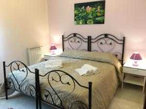 Łóżko lub łóżka w pokoju w obiekcie B&B Villa Giacrì