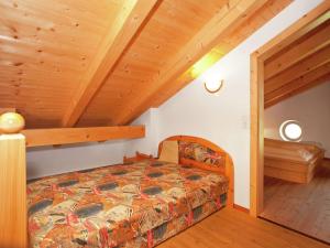 En eller flere senger på et rom på Chalet Chalets Im Wald 3