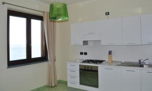 Kuchyň nebo kuchyňský kout v ubytování Residence Tre Palme