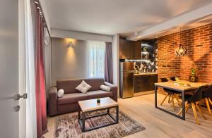 a living room with a couch and a table at Apartment Mondo Deluxe in Kaštela