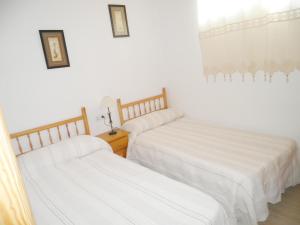 Posteľ alebo postele v izbe v ubytovaní Apartamentos rurales Benafer