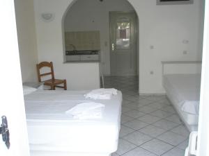 Ένα ή περισσότερα κρεβάτια σε δωμάτιο στο Ampeli Apartments