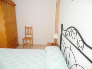 Posteľ alebo postele v izbe v ubytovaní Apartamentos rurales Benafer