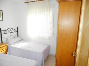 Posteľ alebo postele v izbe v ubytovaní Apartamentos rurales Benafer