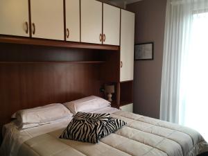 Postel nebo postele na pokoji v ubytování Hotel Cortina