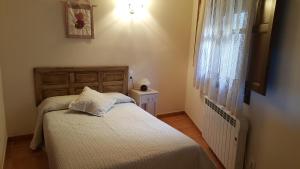 Postel nebo postele na pokoji v ubytování Casa Sampietro