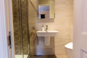 a bathroom with a sink and a shower at Belford House Self Check-in Rooms in Haltwhistle