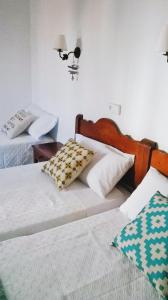 Postel nebo postele na pokoji v ubytování Hostal Rey + 37 fotografií