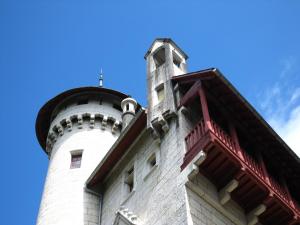 a building with a lighthouse on top of it at Cosy castle with pool in Serrières-en-Chautagne