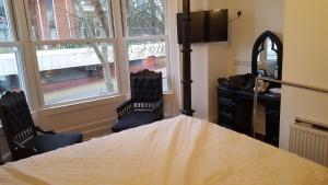 Кровать или кровати в номере The Lodge Harrogate