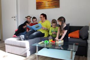 a group of people sitting on a couch at Post Hostel For Youth, Students and Pilgrims in Lavamünd