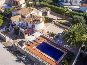 an overhead view of a house with a swimming pool at Gorgeous villa with private pool and near golf course and beach in Benissa