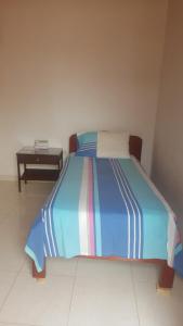 Postel nebo postele na pokoji v ubytování Hotel Orinoco Real