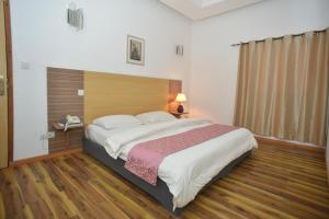 Postel nebo postele na pokoji v ubytování Jess Hotel