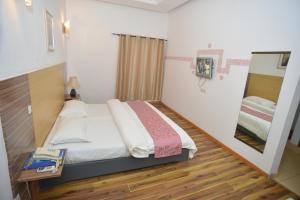 Postel nebo postele na pokoji v ubytování Jess Hotel