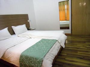 Postel nebo postele na pokoji v ubytování Jess Hotel