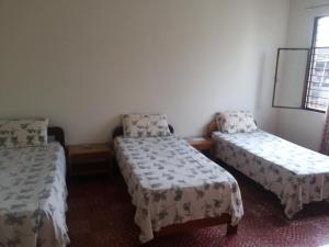 Postel nebo postele na pokoji v ubytování Hotel Orinoco Real