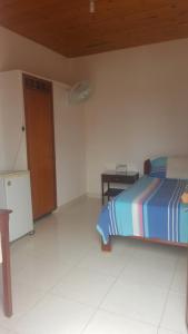 Postel nebo postele na pokoji v ubytování Hotel Orinoco Real