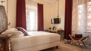 Postel nebo postele na pokoji v ubytování Ripetta Rooms