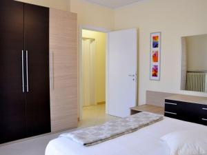 A bed or beds in a room at Holiday Home in Lazise near Lake Garda