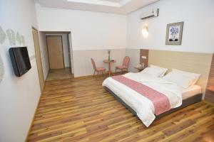 Postel nebo postele na pokoji v ubytování Jess Hotel
