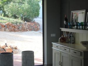 a kitchen with a counter with bottles and wine glasses at Luxurious Villa in Silves with Swimming Pool in Nora