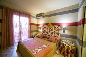 Ein Bett oder Betten in einem Zimmer der Unterkunft Hotel Villamare